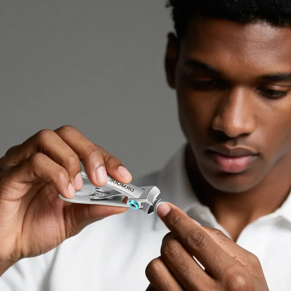 Man using precision nail clippers for grooming, close-up on hands and tool