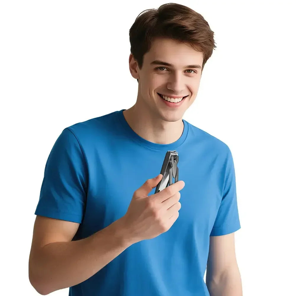 Smiling man in blue shirt holding metal nail clippers against white background