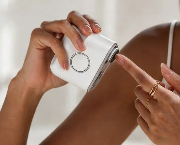 Black woman using DRMODE electric nail clipper for gentle nail filing, inclusive at-home manicure