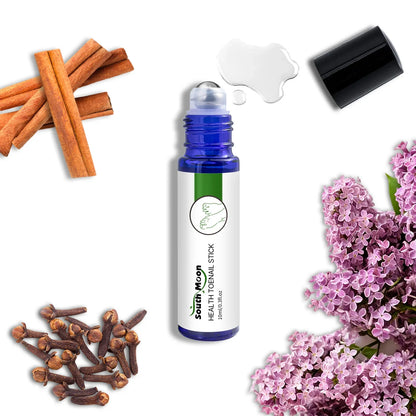 Toenail health oil roller bottle with cinnamon sticks, cloves, lilac flowers, and open cap.
