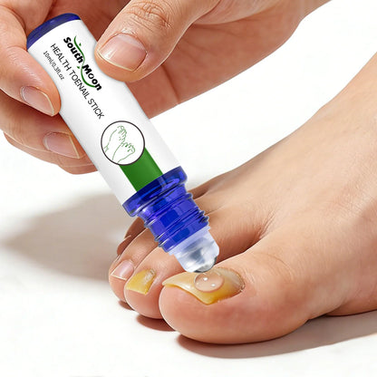 Applying toenail treatment stick to discolored toenail for nail care and fungus treatment