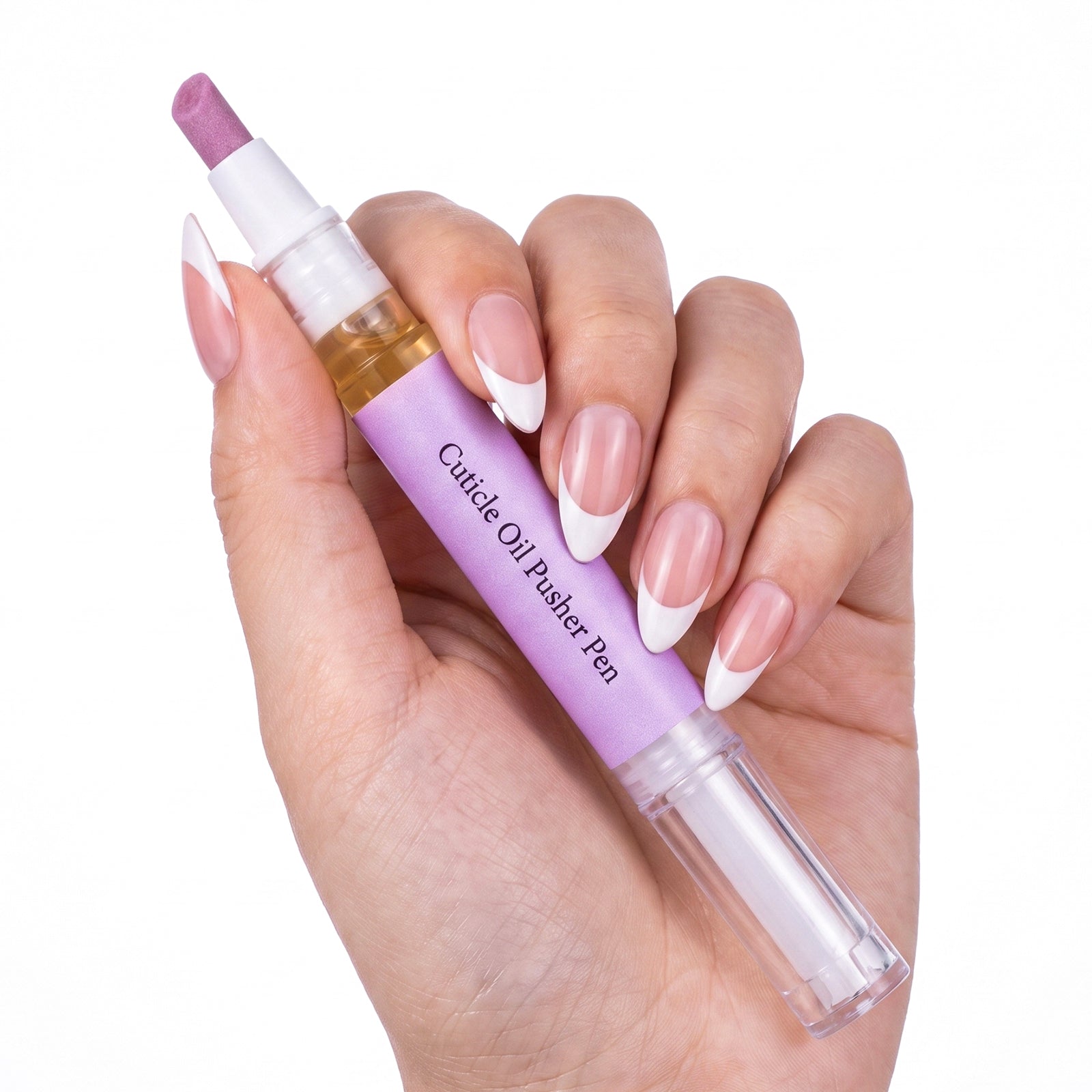 Hand with French manicure holding cuticle pusher oil pen showcasing elegant purple and gold design