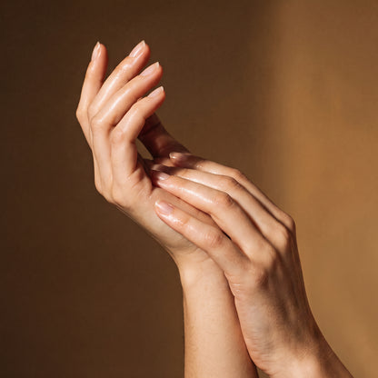 Beautiful hydrated hands after nail care pen treatment showing smooth cuticles and healthy nails